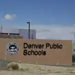 Denver Public Schools sign highlighting ongoing immigration policy lawsuit in Denver, Colorado.