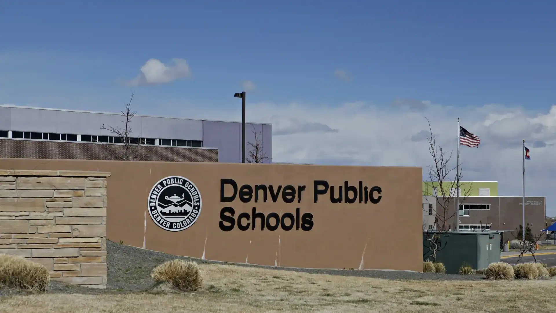 Denver Public Schools sign highlighting ongoing immigration policy lawsuit in Denver, Colorado.