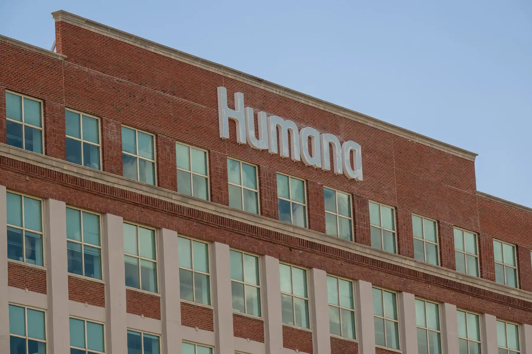 View of the Humana building with prominent signage, representing healthcare and insurance services related to Medicare and legal issues.
