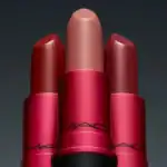 An image showcasing a variety of MAC Cosmetics lipsticks, including shades of red and nude, arranged in a visually appealing manner.