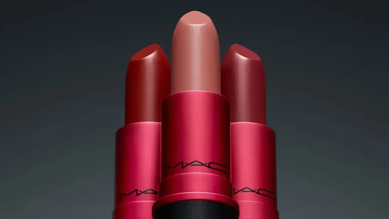 An image showcasing a variety of MAC Cosmetics lipsticks, including shades of red and nude, arranged in a visually appealing manner.