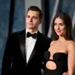 A well-dressed man and woman attending the Together Lawsuit event, showcasing professionalism and style at a formal legal gathering.