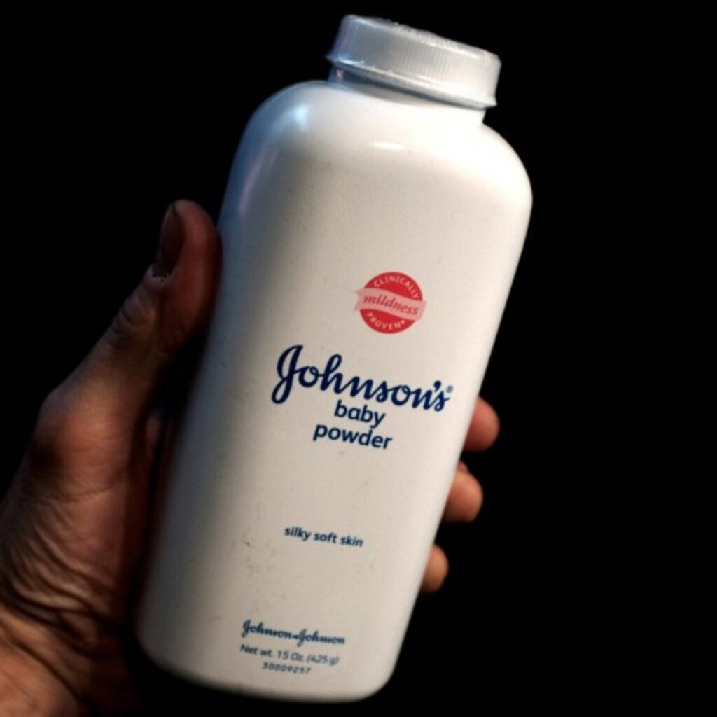 Close-up of Johnson's baby powder bottle, emphasizing the product's branding and packaging.