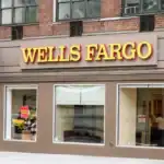 Exterior view of Wells Fargo bank branch with signage and storefront in an urban setting.