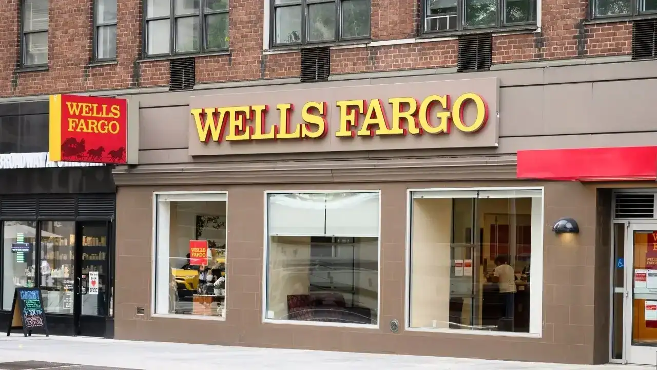 Exterior view of Wells Fargo bank branch with signage and storefront in an urban setting.